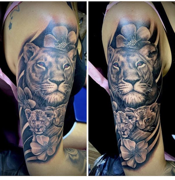 15 black and gray lioness tattoo arm