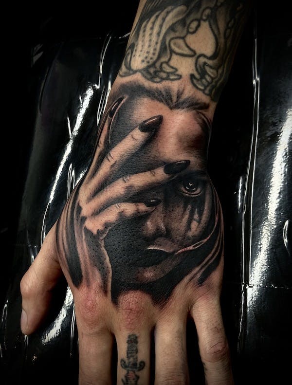 29 black and gray realistic tattoo on hand