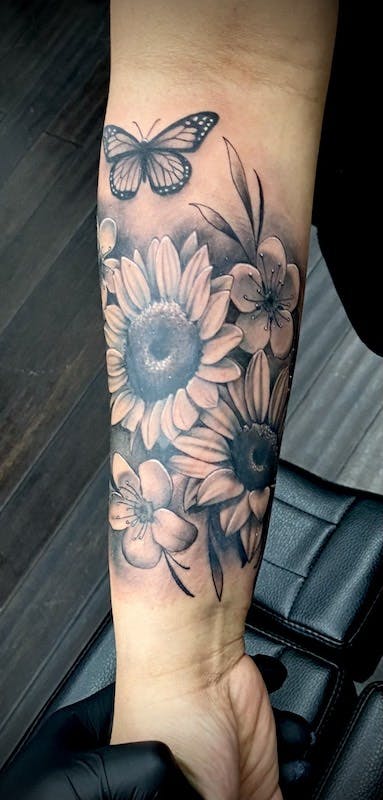 30 black and gray realistic flowers tattoo arm