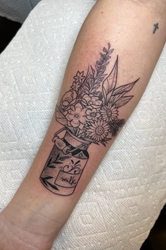 41 Rubio flowers and vase fine line tattoo