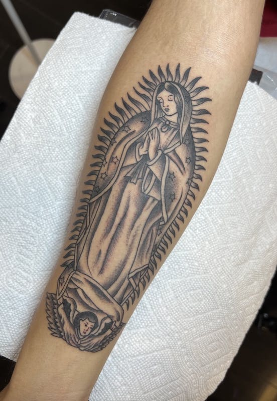 42 Rubio Mary tattoo on arm