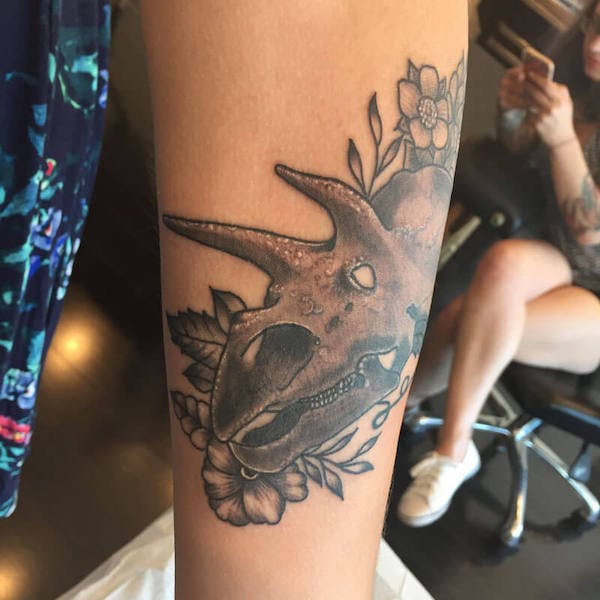 13Matt-color triceratops tattoo on arm