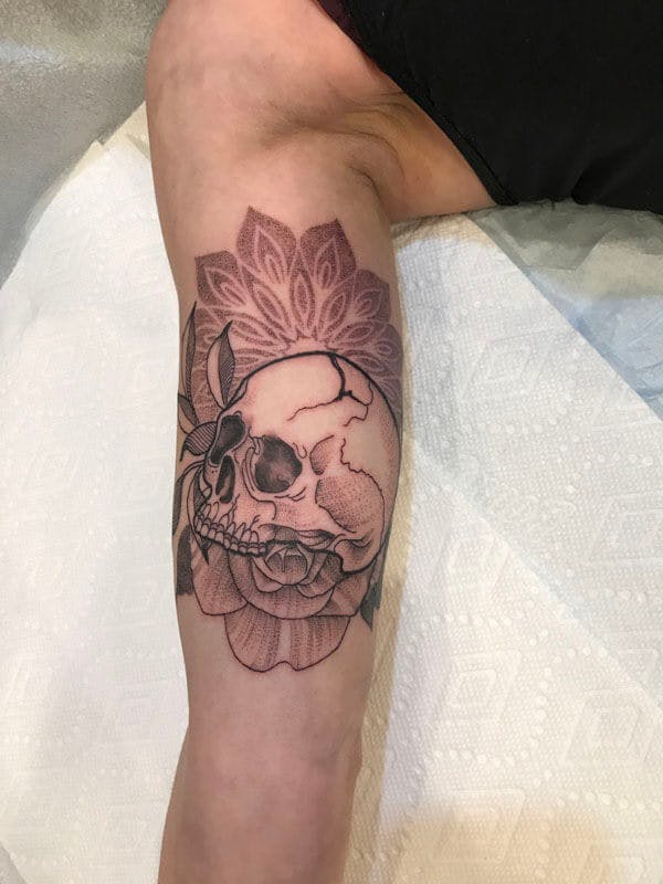 17Matt-black and gray sacred geometry skull tattoo on arm