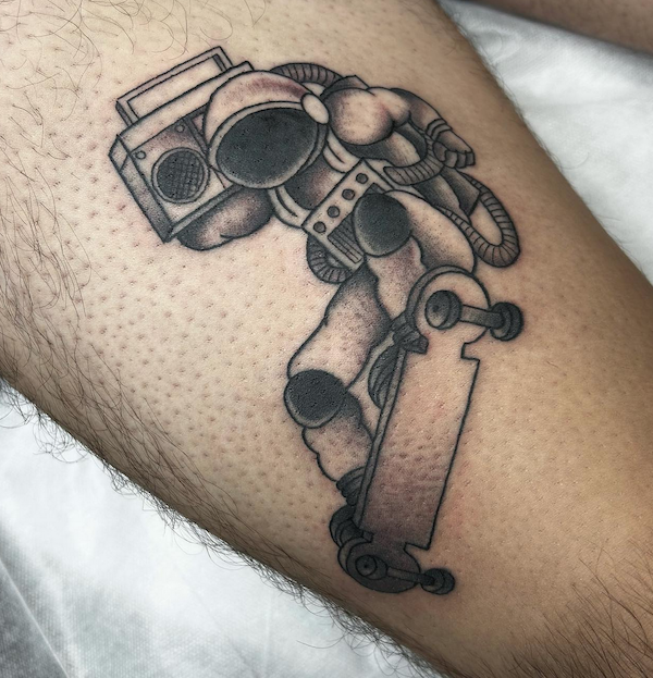 2-Ashley, artist at Fattys Tattoos _ Piercings, skateboard astronaut tattoo on leg