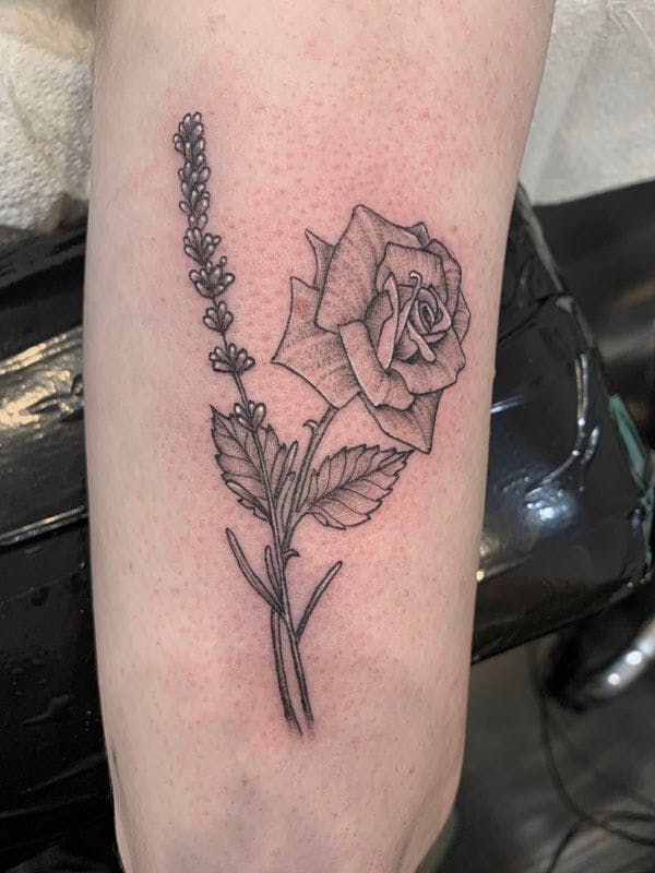 20Matt-black and gray floral tattoo on arm