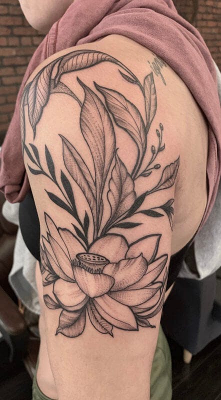 22Matt-black and gray floral tattoo on arm