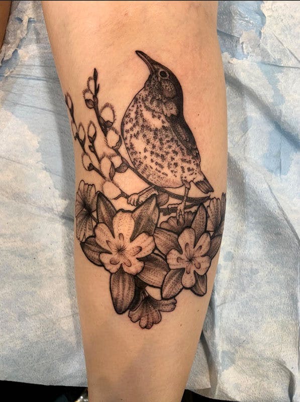 23Matt-black and gray realistic bird tattoo on arm