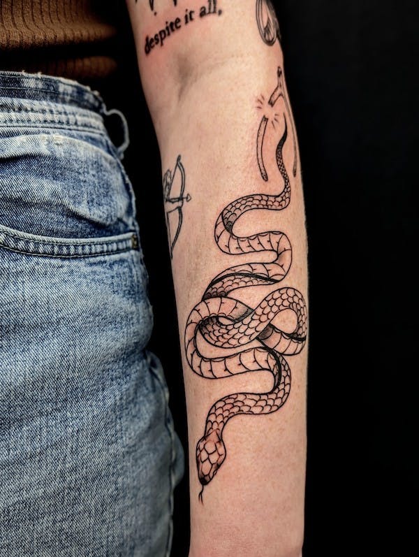 Snake tattoo by Jacqi, artist at Fattys Tattoos & Piercings