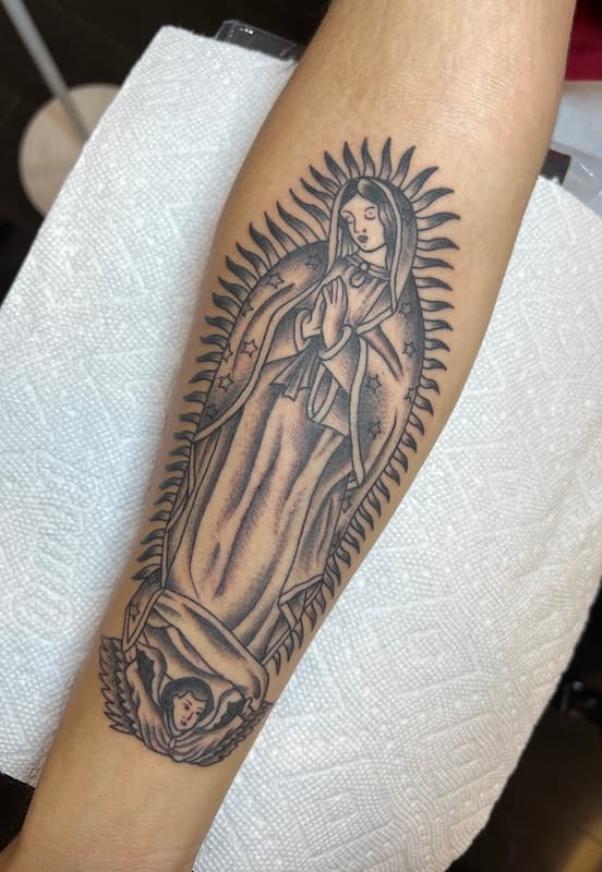 42 Rubio Mary tattoo on arm