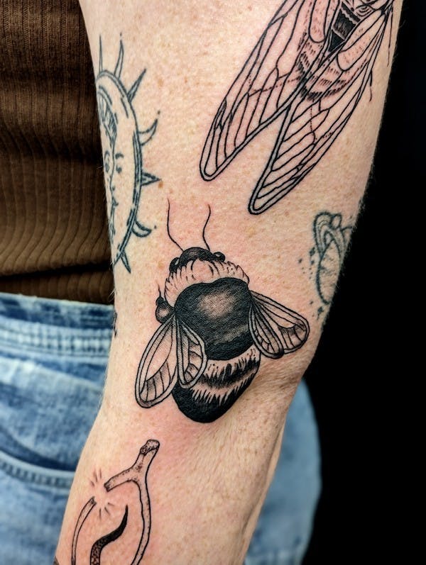 Bumblebee tattoo by Jacqi, artist at Fattys Tattoos & Piercings